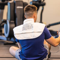 Image of a back of a person with a heating pad on
